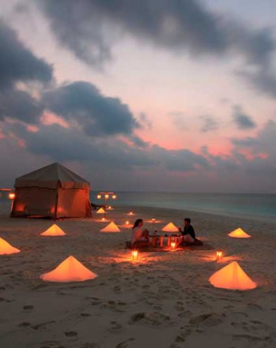 Six Senses - A Couple Relaxing at The Beach at Night