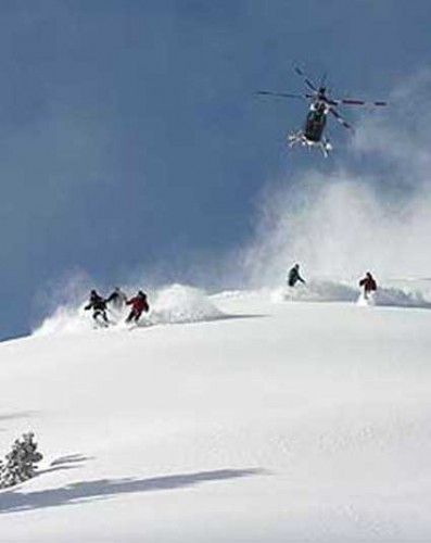 Skiers and Hovering Helicopter That Keeps Watchful Eyes On Them