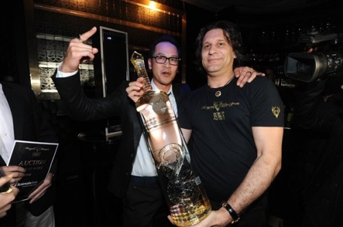Basil Poon snaps up the first six-liter bottle of gold-laced tipple, pictured here with Michael Morren